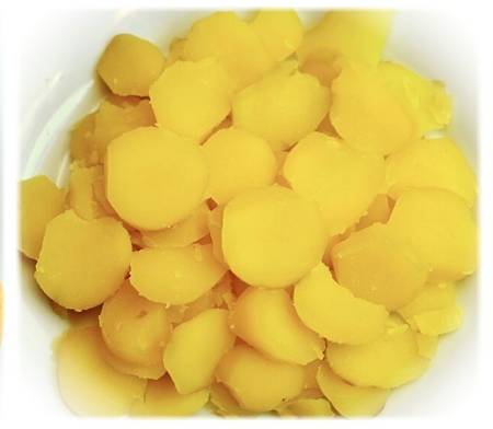 Patate cotte sbucciate e tagliate a fette