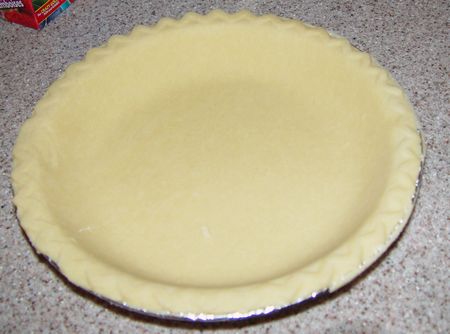 Teglia di alluminio foderata con pasta brisée cruda